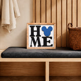 HOME square framed wood sign with blue mouse head icon styled on a mudroom bench