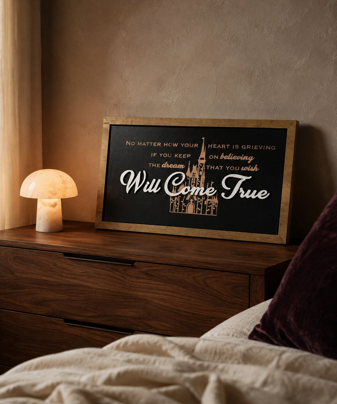 Dream That You Wish Will Come True castle lyric framed wood sign styled on a walnut dresser at dawn