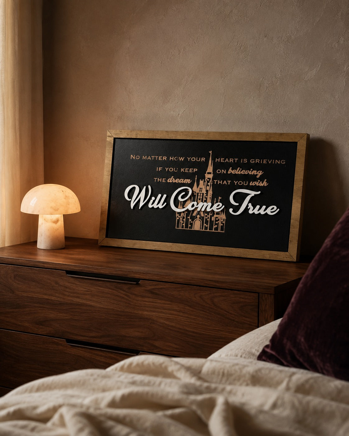 Dream That You Wish Will Come True castle lyric framed wood sign styled on a walnut dresser at dawn