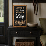 A House Is Not A Home Without A Dog framed wood sign styled on a black entry table in a boot room