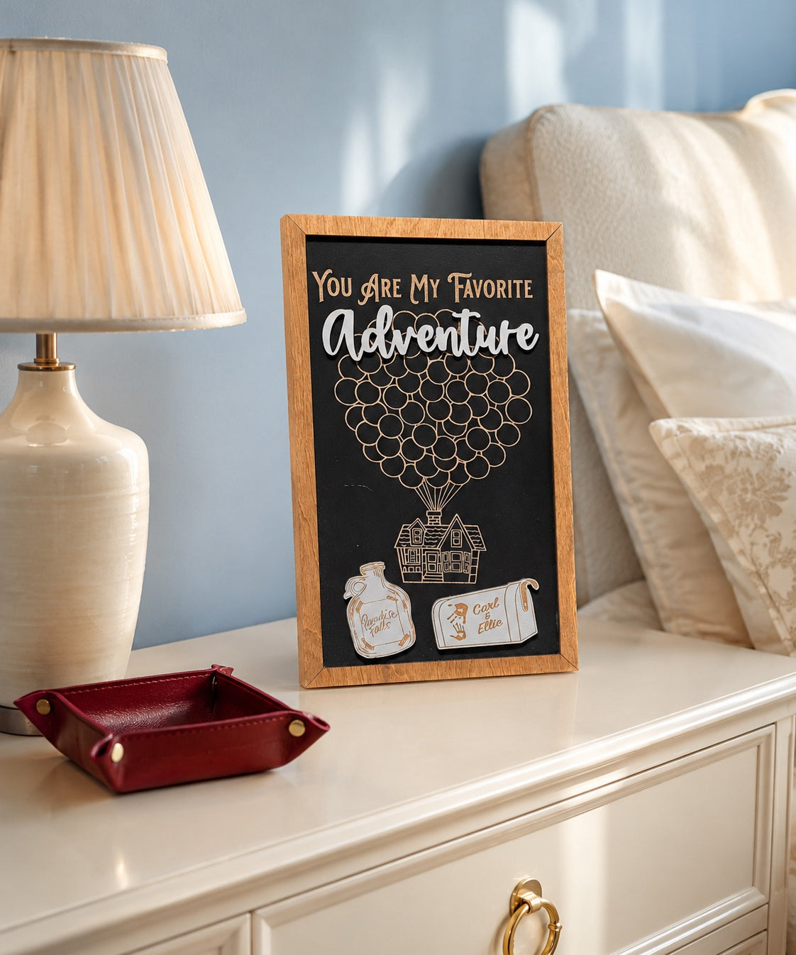 You Are My Favorite Adventure balloon house framed wood sign styled on a nightstand in a romantic guest room