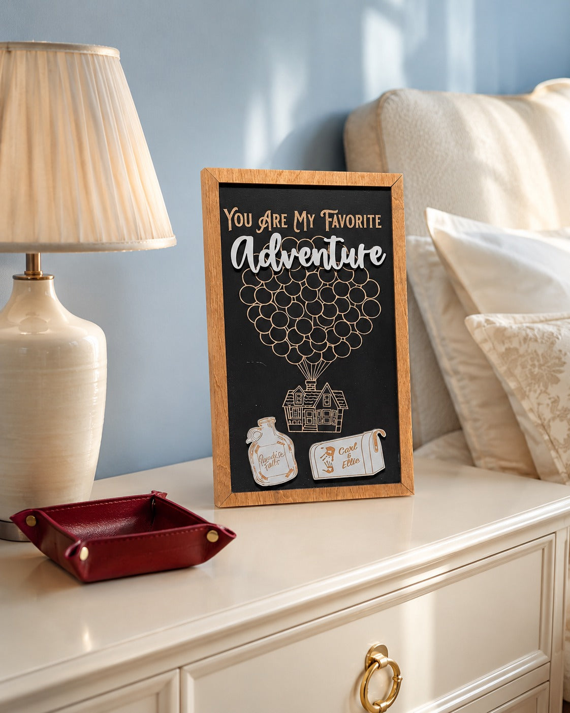 You Are My Favorite Adventure balloon house framed wood sign styled on a nightstand in a romantic guest room