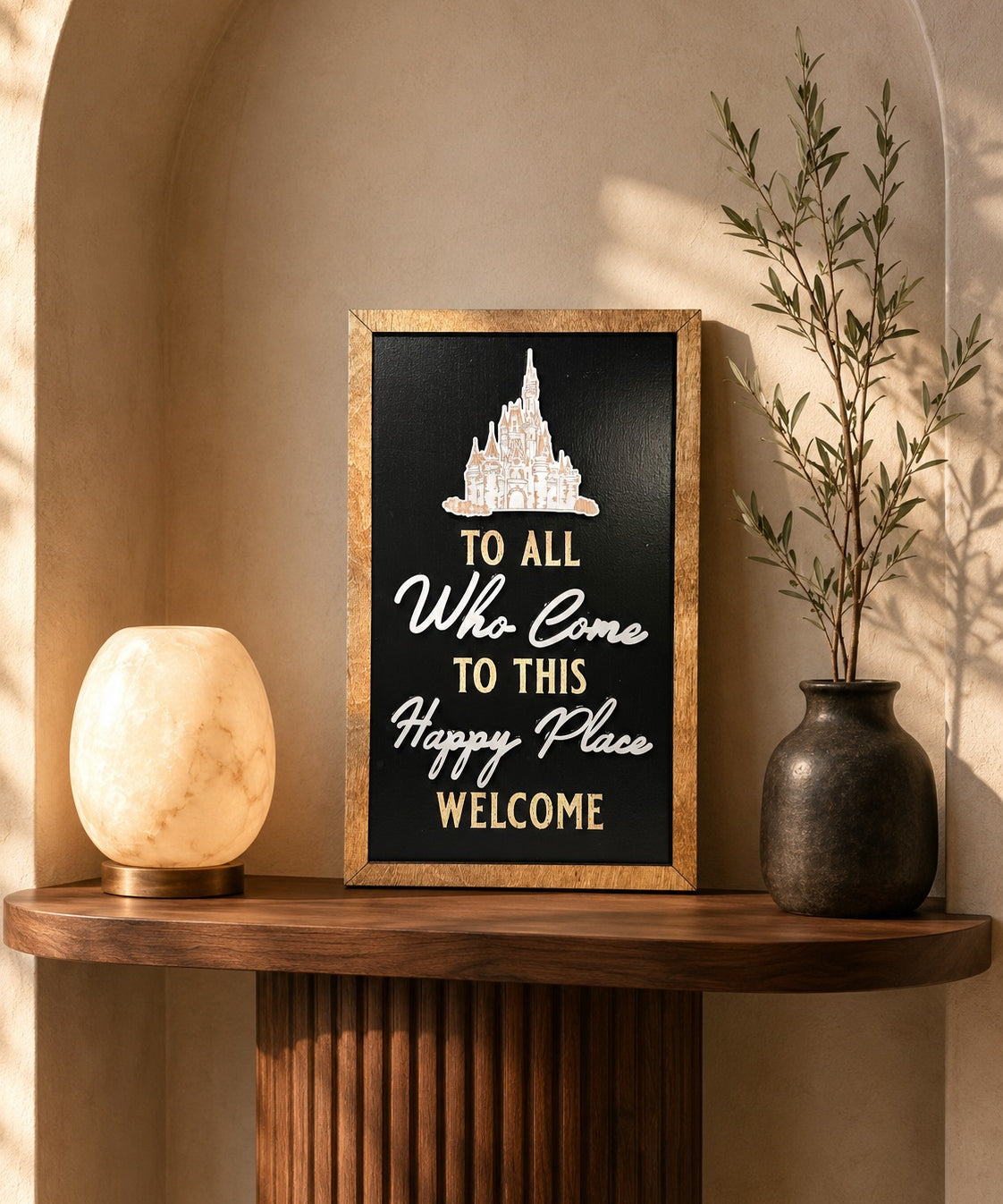 To All Who Come To This Happy Place Welcome dedication plaque framed wood sign styled in a golden hour vestibule