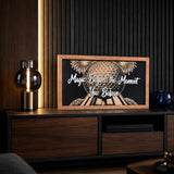 Magic Begins The Moment You Believe geodesic sphere framed wood sign styled on a walnut media console