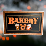 Orange Icing Fall Main Street Bakery | Black Background Framed Halloween Sign