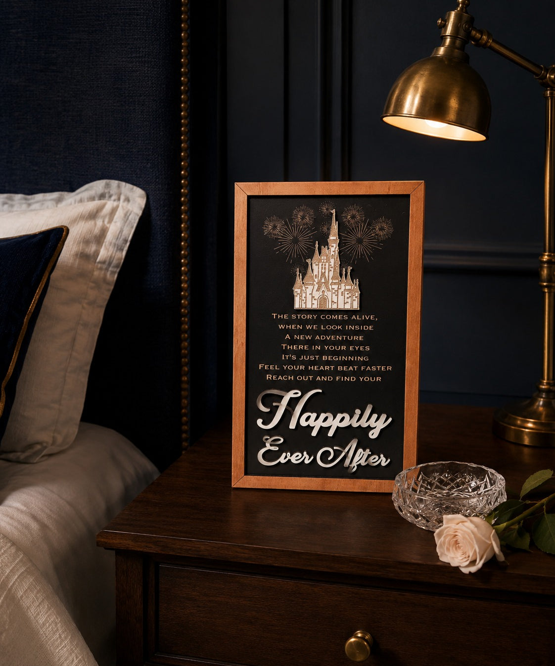 Reach Out And Find Your Happily Ever After lyrics fireworks framed wood sign styled on a nightstand in a midnight blue bedroom