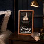 Reach Out And Find Your Happily Ever After lyrics fireworks framed wood sign styled on a nightstand in a midnight blue bedroom