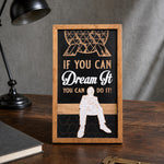 If You Can Dream It You Can Do It geodesic sphere framed wood sign styled on a dark oak desk
