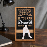 If You Can Dream It You Can Do It geodesic sphere framed wood sign styled on a dark oak desk