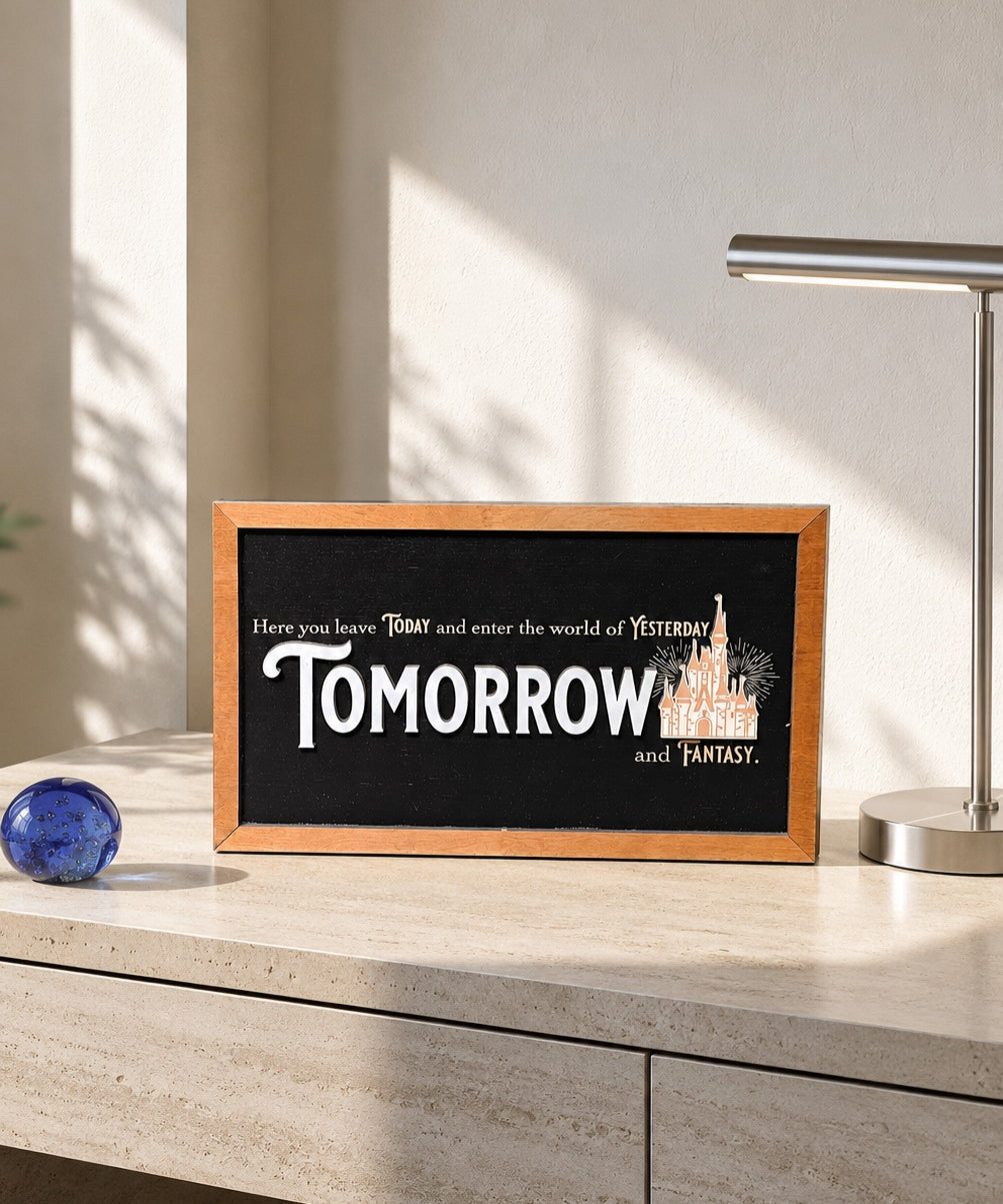Here You Leave Today castle tribute framed wood sign styled on a sunlit travertine credenza