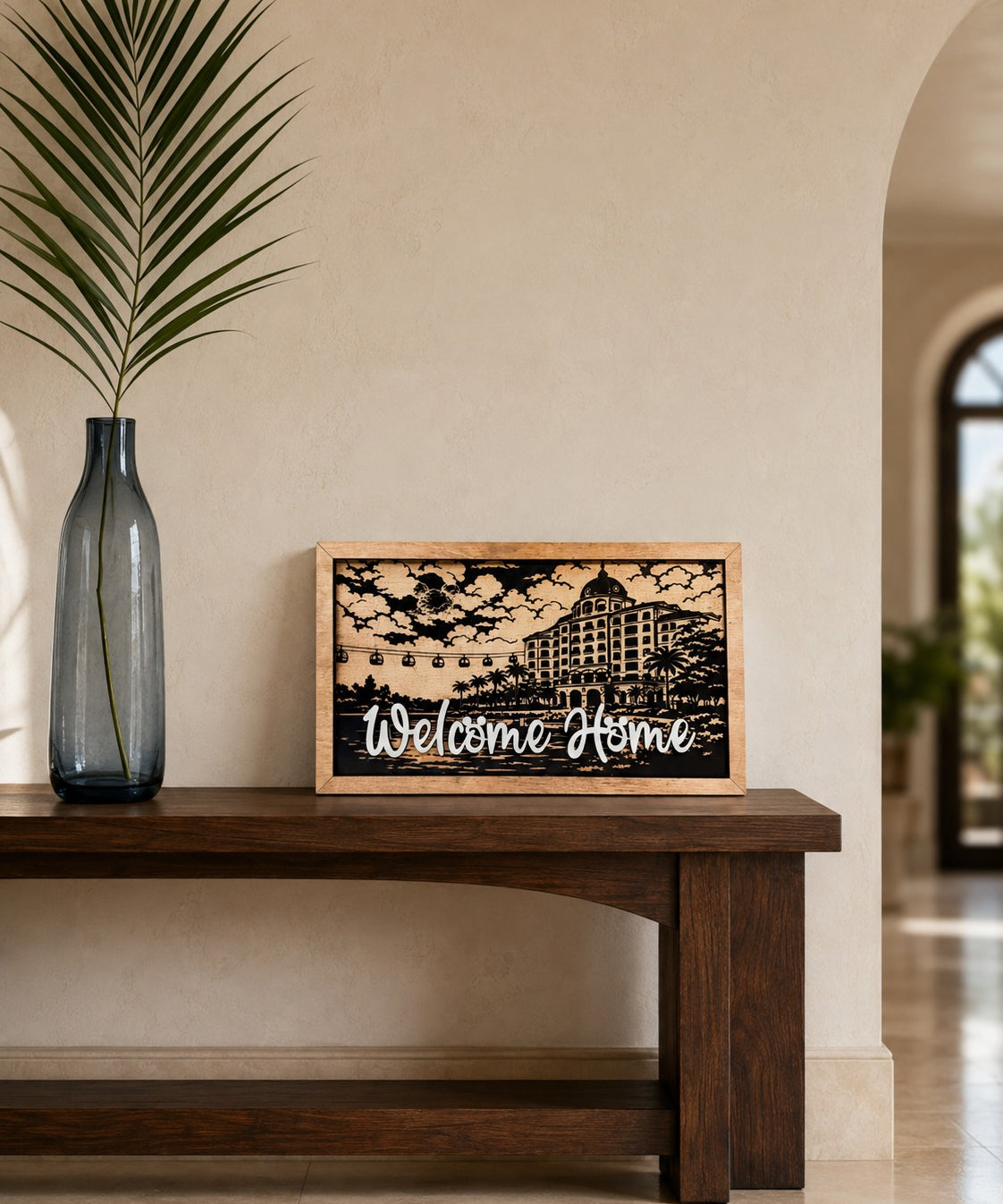 Welcome Home Riviera resort framed wood sign styled in a coastal gallery hall