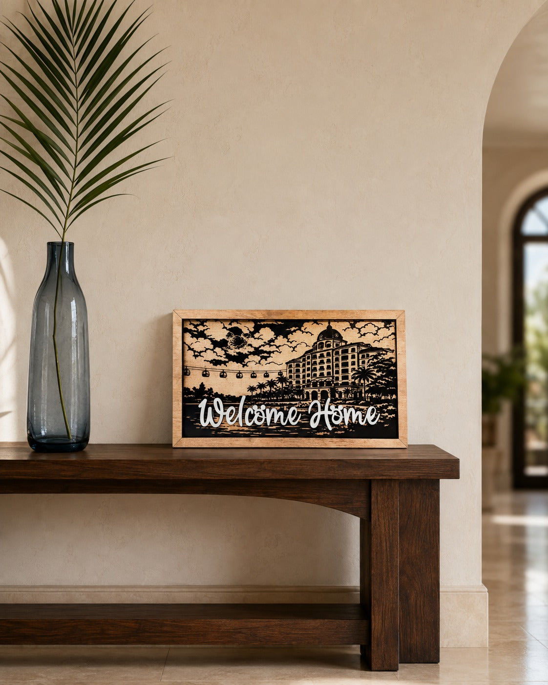 Welcome Home Riviera resort framed wood sign styled in a coastal gallery hall