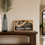 Welcome Home Riviera resort framed wood sign styled in a coastal gallery hall