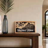 Welcome Home Riviera resort framed wood sign styled in a coastal gallery hall