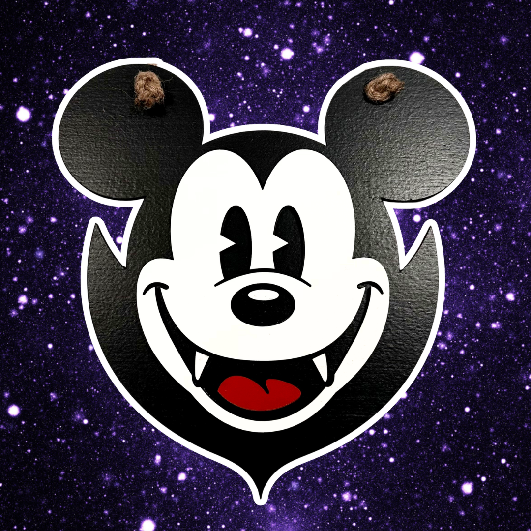 Vampire mouse head Halloween sign with fangs on starfield background