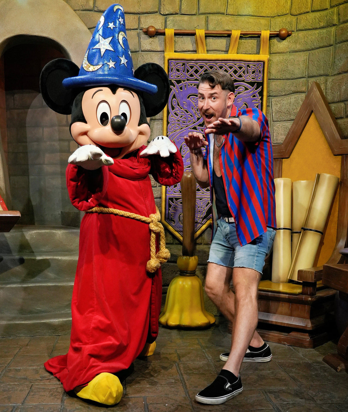 Justin Ray beside Sorcerer Mickey, in the authentic photograph used on the JRW website.