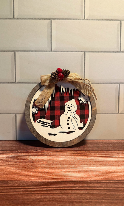 Round Wooden Red/Black Plaid Snowman Scene Ornament