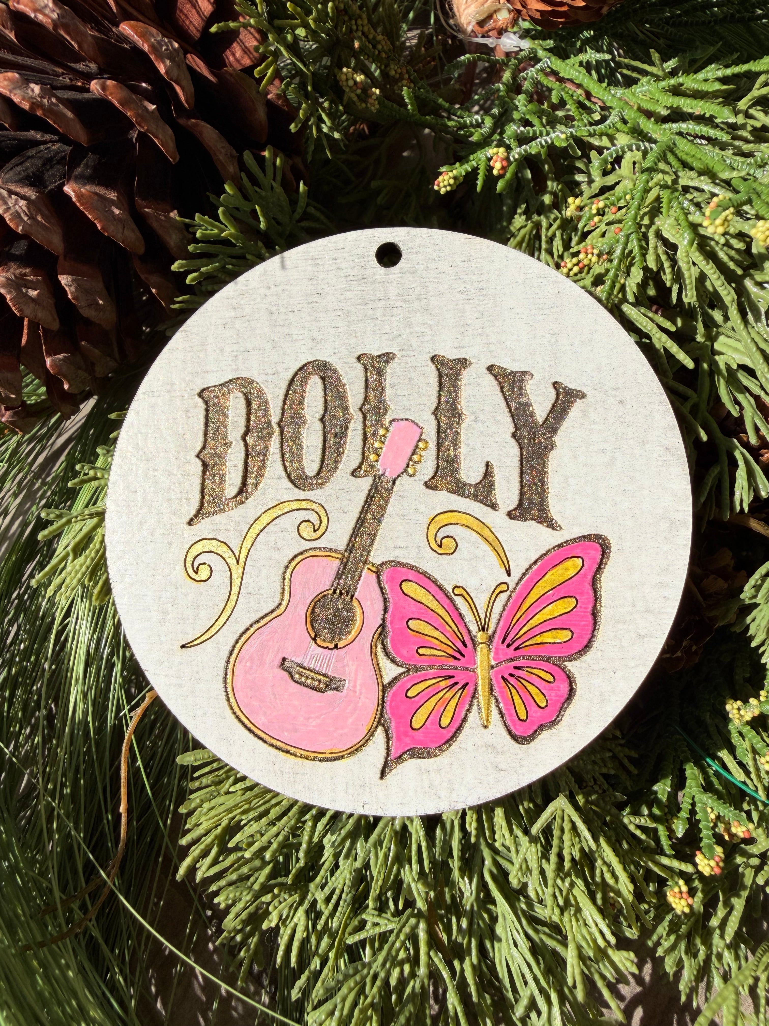 Finished hand-painted Dolly Guitar & Butterfly on evergreen greenery.