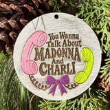 Finished hand-painted Madonna & Charli Holiday Telephone on evergreen greenery.