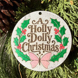 Finished hand-painted A Holly Dolly Christmas Wreath on evergreen greenery.
