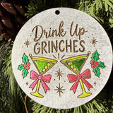 Finished hand-painted Drink Up, Grinches on evergreen greenery.