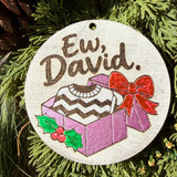 Finished hand-painted Ew, David Gift Box on evergreen greenery.