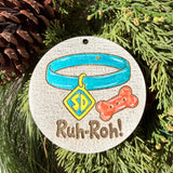 Finished hand-painted Ruh-Roh! Dog Collar on evergreen greenery.