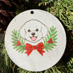Finished hand-painted White Fluffy Dog & Holiday Bow on evergreen greenery.