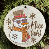 Finished hand-painted Nice(ish) Snowman on evergreen greenery.