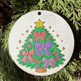 Finished hand-painted Christmas Tree with Pink & Purple Bows on evergreen greenery.