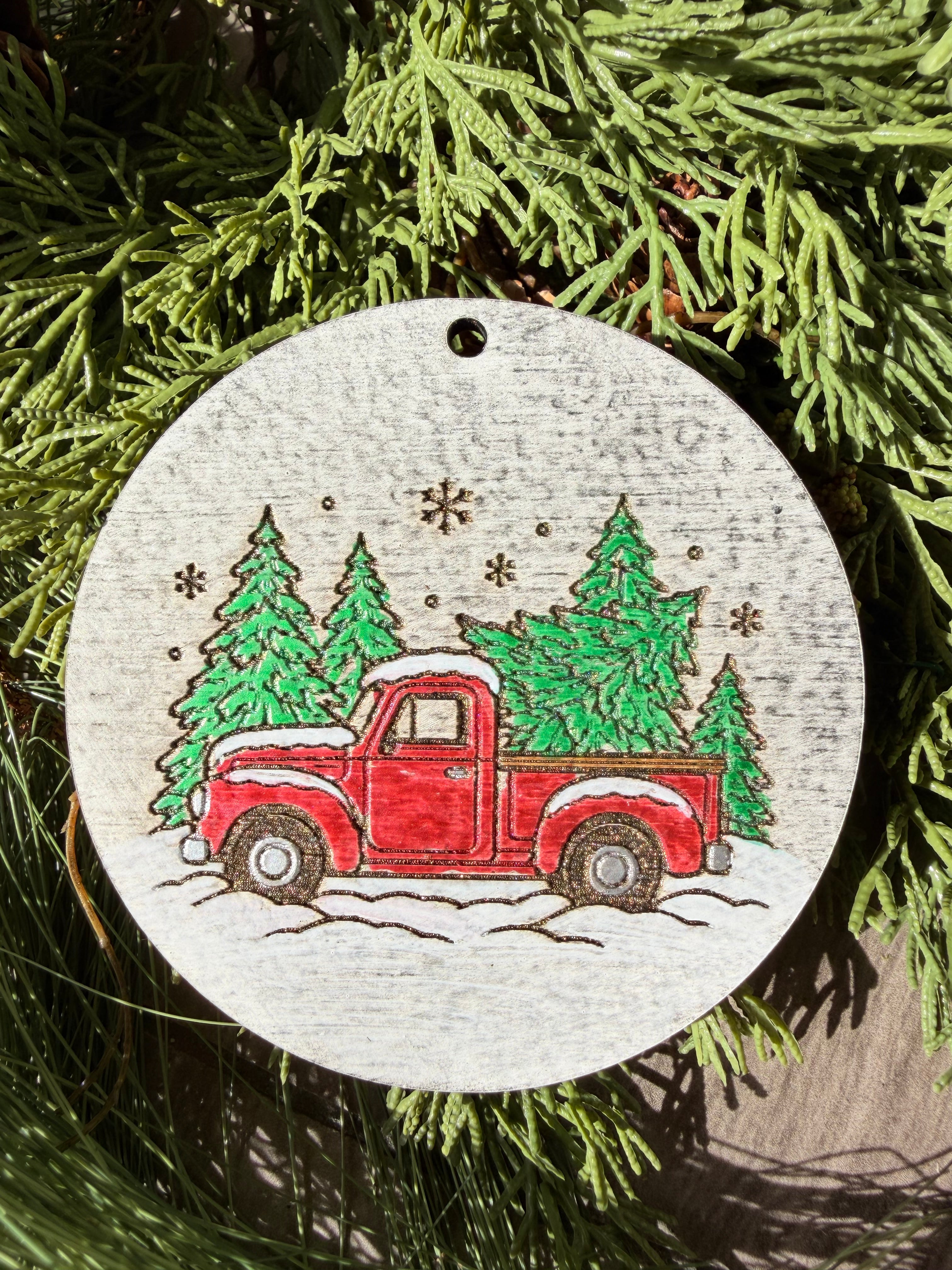 Finished hand-painted Evergreen Red Pickup Truck on evergreen greenery.