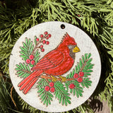 Finished hand-painted Winter Cardinal on evergreen greenery.