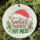 Finished hand-painted Santa’s Favorite Hot Mess on evergreen greenery.
