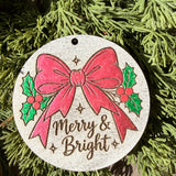 Finished hand-painted Merry & Bright Pink Bow on evergreen greenery.