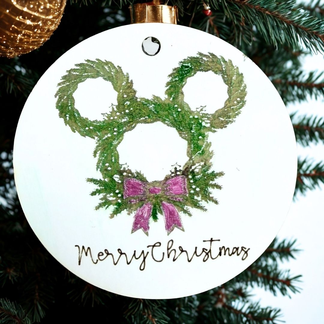 2026 Merry Christmas mouse pine wreath ornament hanging on a Christmas tree
